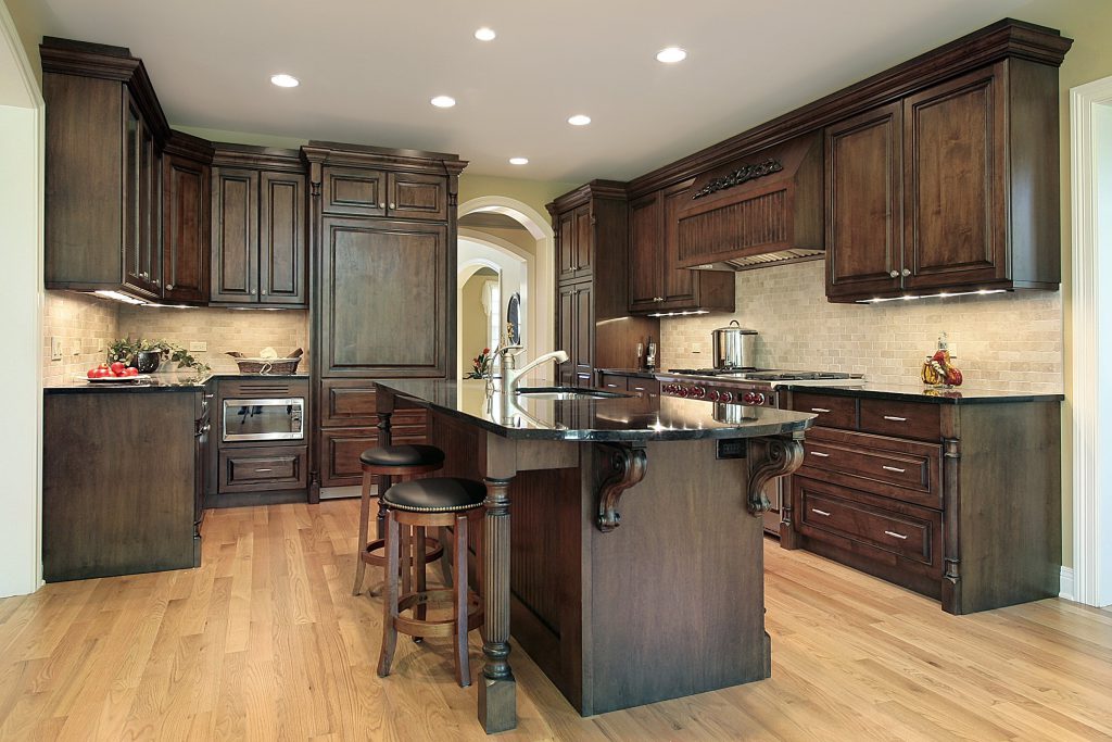 dark kitchen cabinet with light flooring